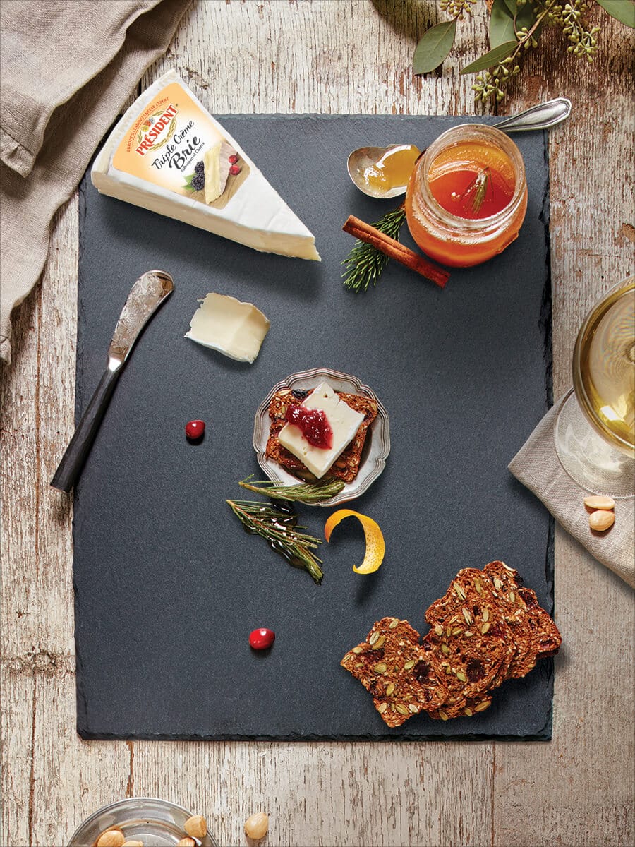 Platter decorated with various condiments, spruce tip honey and cheese