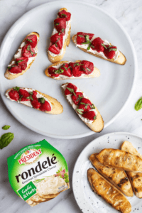 Grilled crostini topped with rondele cheese and strawberries